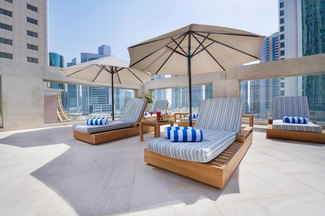 Wyndham Grand Doha West Bay Beach Eksteriør bilde The pool deck at the hotel